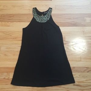 Black shift dress with emerald details